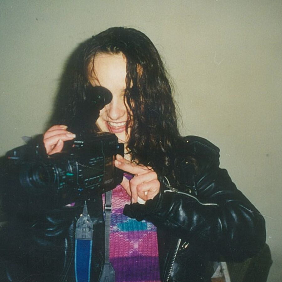 a female director looking through the lens of her video camera